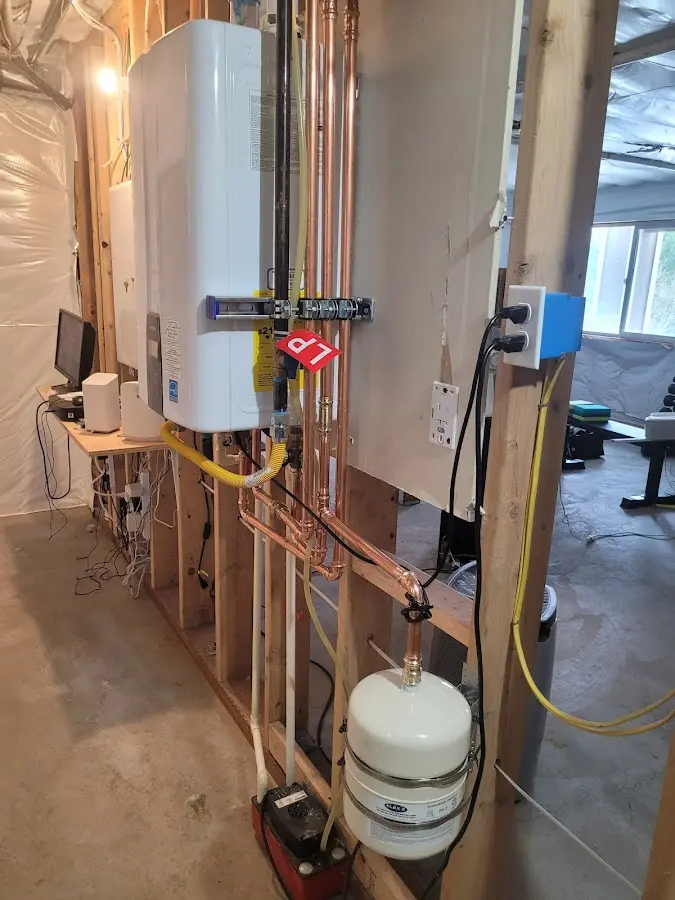 Licensed plumber repairing a kitchen sink in Gresham